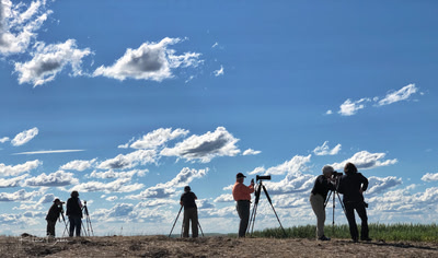 Six photographers are lined up